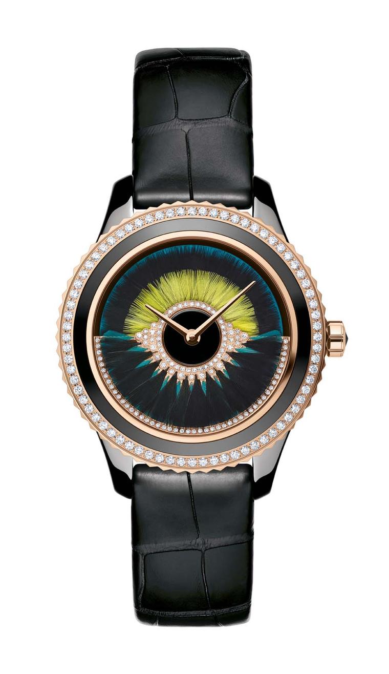 Dior VIII Grand Bal Cancan watch in a 38mm pink gold and black ceramic case with a peacock blue lacquered dial decorated with two rows of black and yellow feather marquetry. The oscillating weight on the dial swirls with peacock blue and black feathers an